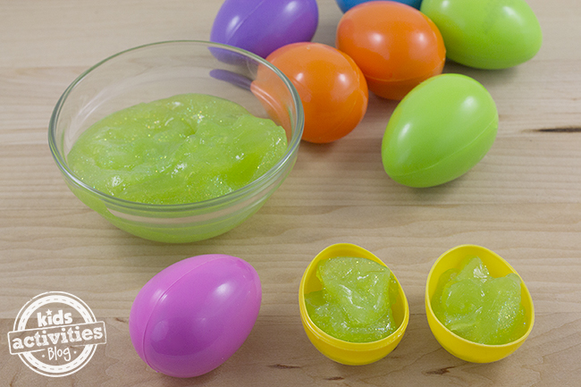 Gak Filled Easter Eggs step 2 - press a little Gak into each side of the plastic Easter egg
